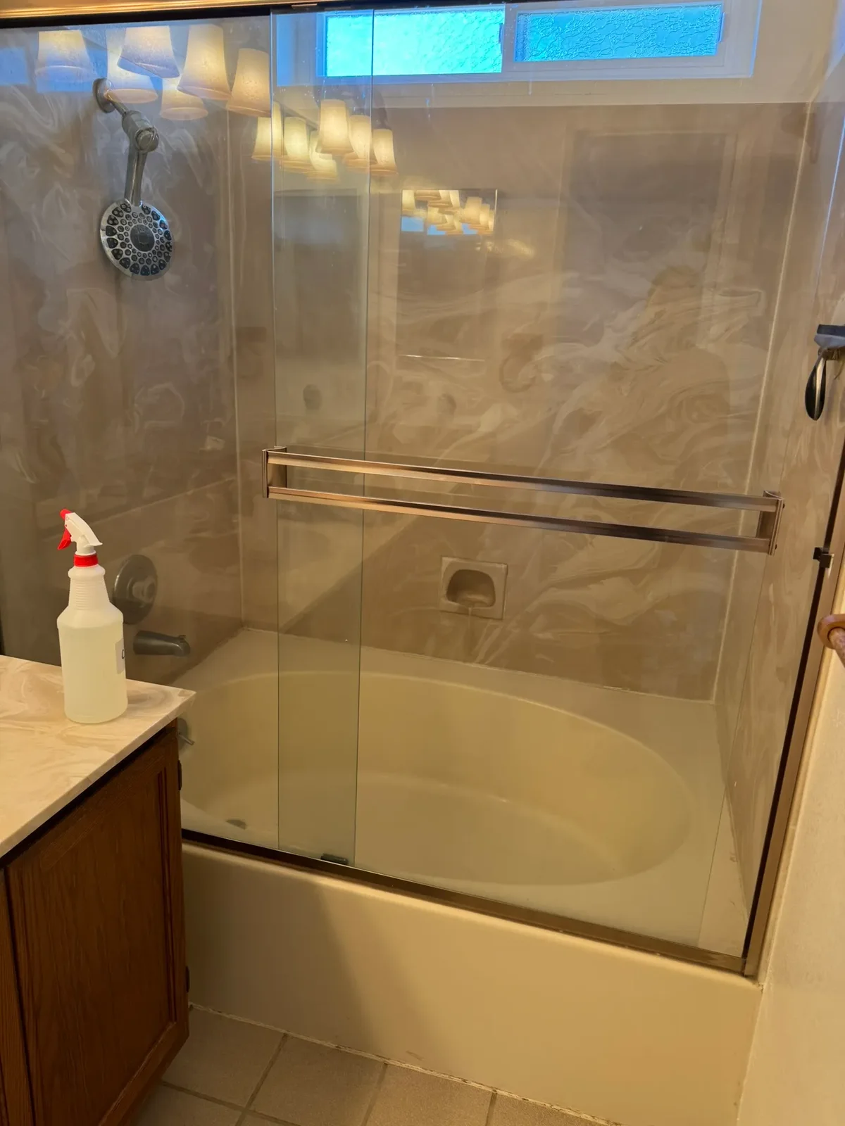 Glass-door shower and vanity after a detailed clean