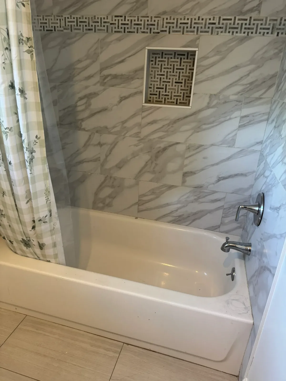 Marble tub and shower surround, cleaned and polished