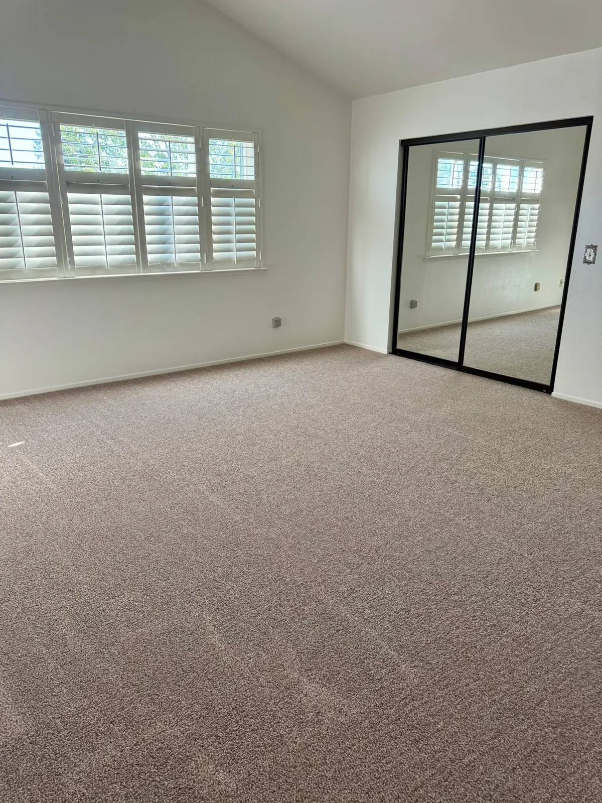 Bedroom with plantation shutters, ready for move-in